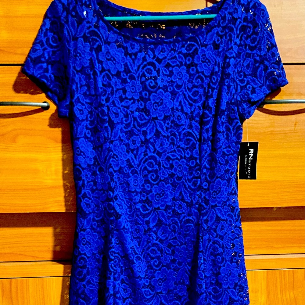 Dress - comes to below knee. Beautiful net type dress!